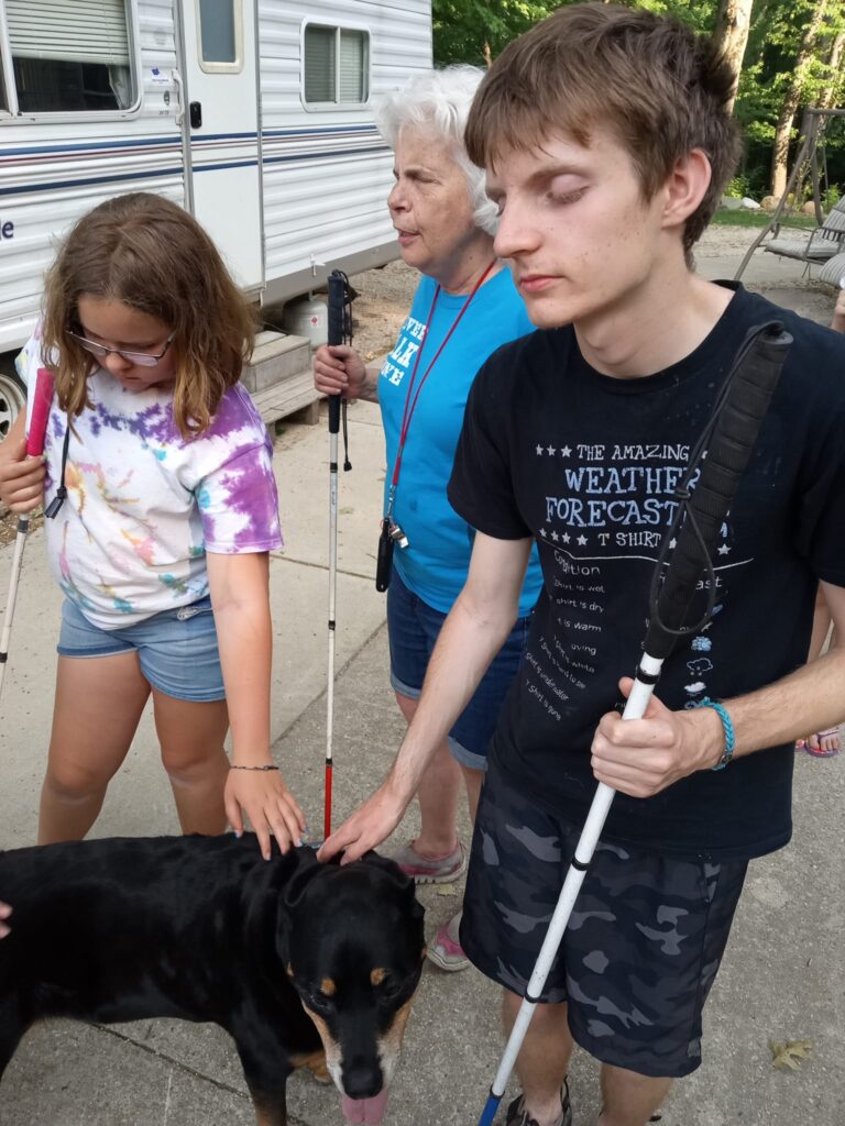 Campers petting a dog
